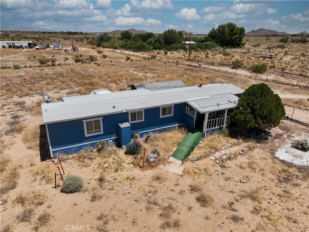 Spacious 3-bedroom, 2-bath manufactured home on a permanent foundation, situated on 2.55 acres in Mojave. This home features an updated kitchen with granite countertops, new flooring, refreshed bathrooms, and modern finishes throughout. The property includes its own well and power hookup, offering convenience and self-sufficiency. Located within the Mojave Unified School District and close to Mojave Elementary and Mojave Jr./Sr. High School, it also provides easy access to shopping, dining, and everyday essentials along Highways 14 and 58. With plenty of land and a central location, this home offers comfort, space, and accessibility.
