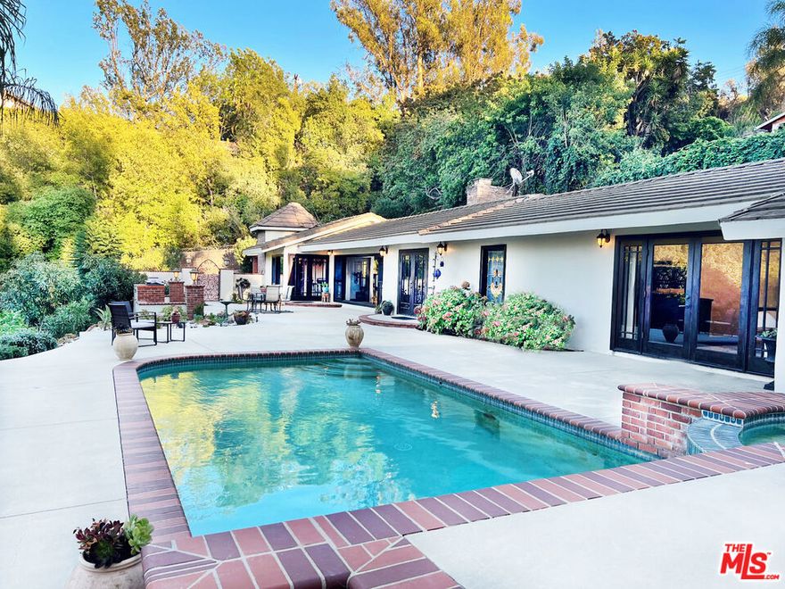 Private gated retreat, off iconic Mulholland Drive. Fully furnished, single-story luxury lease on over 1/2 acre of lush, landscaped grounds. High ceilings throughout, expansive windows, abundant natural light, picture-perfect canyon and city views. Featuring a grand living room with a fireplace, formal dining, gourmet kitchen with Miele & Sub-Zero, breakfast counter, master suite with pool and city views, cedar walk-in closet, spa-like bathrooms with floor to ceiling travertine, lots of closets, separate laundry room, plus 3 additional stylish bedrooms, one in a separate wing of the house. Outdoor oasis with sparkling pool, spa, serene succulent gardens, and tranquil nature sounds. Moments to Beverly Hills, Studio City, legendary hiking trails Tree People, top shops & dining, easy freeway access 405/101.  Available short or long term. Best of BHPO living...quiet, private, upscale.