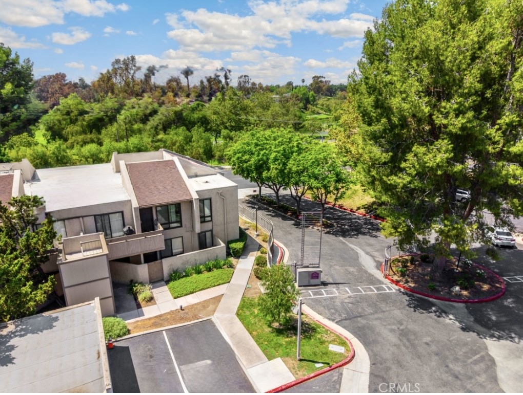 Lovely 2-bedroom, 2-bathroom condo in the tree lined gated community of Park Ridge in Fullerton. This FHA approved complex features 136 units, a pool, tennis and basketball courts, gym, clubhouse, and is located directly across the street from Craig Park. This upper-level end unit offers additional privacy and natural light. Features include open floor plan with vaulted ceilings, TWO PRIMARY SUITES, each with it's own bathroom, a large living room, breakfast bar, dining area and detached garage. Great location near Cal State Fullerton, Fullerton College Brea Mall, 57 & 91 freeways, and Downtown Fullerton and Brea! HOA fees include all utilities except electric bill. Also it includes fire insurance, gated community, security and common area maintenance. And of course, minutes from Disneyland! Quite and friendly community with an abundance of parking for visitors and second vehicles. New appliances, recently remodeled bathrooms and Vinyl Flooring, recessed lighting and ceiling fans. This complex has an abundance of parking, and being a small community , the neighbors are very easy to deal with. This condo literally has it all!