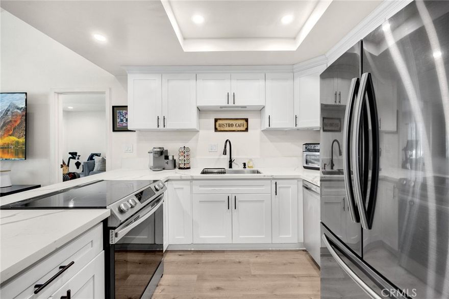 NEW PRICE IMPROVEMENT!  Gorgeous 2-bed, 2-bath condo in the tree lined GATED COMMUNITY of Park Ridge in Fullerton.  This FHA approved complex features 136 units, a pool, tennis and basketball courts, gym, clubhouse, individual garages and is located directly across the street from Craig Park.   This upper-level end unit offers additional privacy and natural light.  Features include open floor plan with vaulted ceilings, TWO PRIMARY SUITES, each with it's own bathroom, a large living room, breakfast bar, dining area and detached garage.  Great location near Cal State Fullerton, Fullerton College Brea Mall, 57 & 91 freeways, and Downtown Fullerton and Brea!  HOA fees include ALL UTILITIES except electric bill.  Also it includes fire insurance, gated community, security and common area maintenance.  And of course, minutes from Disneyland!  Quite and friendly community with an abundance of parking for visitors and second vehicles.  New appliances, recently remodeled bathrooms and Vinyl Flooring, recessed lighting and ceiling fans.  This complex has an abundance of parking, and being a small community , the neighbors are very easy to deal with.  This condo literally has it all!