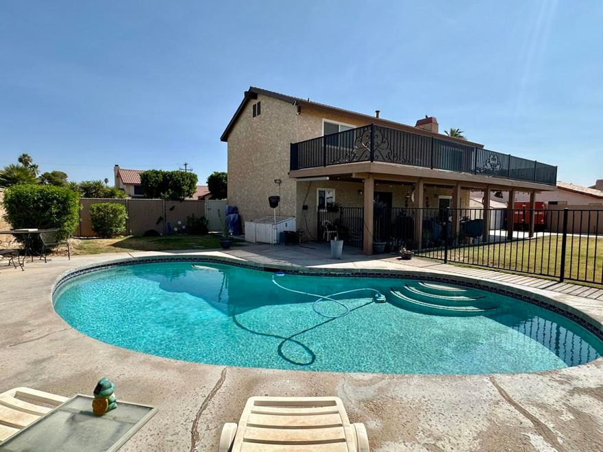 Spacious Two-Story Home with Solar, Pool & Multiple Outdoor Living SpacesWelcome to this beautiful three-bedroom, two-and-a-half bath, two-story home located in a desirable neighborhood & a short distance to the Colorado River. This home is filled with thoughtful upgrades and designed for comfortable living both inside and out.Step inside to find dual-pane windows throughout, two living areas, perfect for entertaining, an open dining area, and   kitchen with bar seating. The indoor laundry adds convenience, while the oversized master suite offers a walk-in closet, dual sinks, a tiled shower, and direct access through a slider to a private covered deck--perfect for tanning, relaxing, and enjoying the amazing views.Enjoy California living with:&#10004;&#65039; Solar panels installed in 2022 - just $138/month for low electric bills&#10004;&#65039; Newer roof and newer water softener&#10004;&#65039; Fresh exterior paint, including trim and doors (less than a year old)&#10004;&#65039; Three retractable patio shade covers for comfort and versatility&#10004;&#65039; French doors leading to the backyard from dining area&#10004;&#65039; Covered back patio, privacy fencing all around, and a storage shed on the side&#10004;&#65039; Steel carport perfect for trailer parking and concrete slab in back with gate access for boat storage or desert toys. The pool area is gated for child protection, with covered pool equipment for easy maintenance. The patio roof and rooftop deck flooring have been fully redone, creating the perfect outdoor entertaining space.This home offers privacy, energy efficiency, and spacious living areas--all in a fantastic neighborhood. Don't miss your chance to make this move-in-ready property yours!