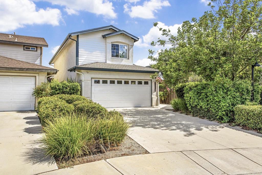 Welcome to 1308 Oak Village Court, Ramona—a beautifully maintained single-family home featuring 3 bedrooms and 3 bathrooms across approximately 1,672 square feet. The moment you step inside, you're greeted by an impressive open layout that perfectly blends functionality with style. The great room is an entertainer's dream, boasting soaring ceilings that create a sense of grandeur and spaciousness. Natural light floods the area through large windows, highlighting the elegant design and providing a warm, inviting atmosphere. This expansive space seamlessly connects the living and dining areas, making it ideal for both casual family gatherings and formal entertaining. The kitchen, also part of this open design, is equipped with modern appliances and ample counter space, allowing you to prepare meals while engaging with guests. The layout encourages interaction, making it easy to entertain or keep an eye on family activities while cooking. Step outside to enjoy the tranquility of your surroundings, with no side neighbor, thanks to the home’s backing onto a peaceful green belt park area. Access to outdoor space is easily made from the main living area, further enhancing the airy and open feel. Adding to the home's allure are the high vaulted ceilings that enhance the overall ambiance, providing a sense of freedom and light. This combination of a great open layout and soaring ceilings creates an inviting and spacious environment that is both comfortable and visually striking. As part of a desirable community, residents can take full advantage of the amenities, including a sparkling community pool and spa—perfect for relaxing on sunny days or unwinding after a long week. Additionally, the monthly HOA fee includes water, making for one less utility concern. With a two-car attached garage and situated in a tranquil neighborhood close to parks and local amenities, this home offers an exceptional blend of comfort, privacy, and convenient living. Built in 2001, it combines classic design with thoughtful details for everyday ease.