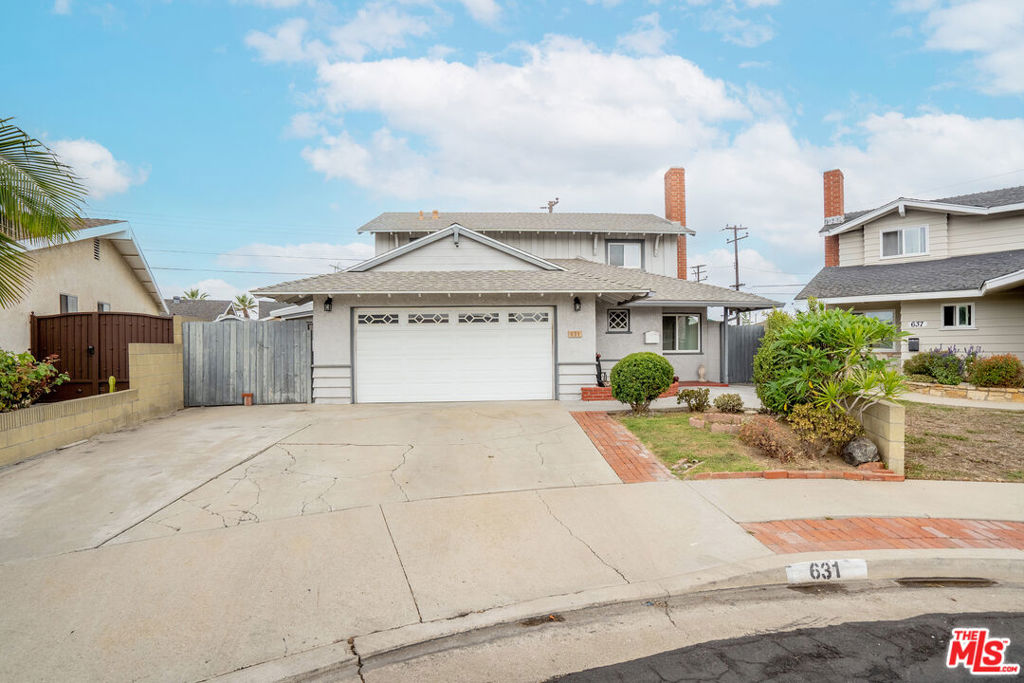 Located at the end of a cul-de-sac, this two-story home offers over 2,000 square feet of living space. The first floor features a welcoming living room with fireplace, an open kitchen and dining area, a family room, and a bathroom. An additional two-room studio with bath and separate entrance provides flexibility for extended family, guests, or a home office. The second level includes 3 bedrooms, including the primary suite, and 2 bathrooms. The property also features an EV charger conveniently located in the garage, ideal for electric vehicle owners. Centrally located with easy access to Carson and Calas Parks, restaurants, shopping centers, schools, and the 110 and 405 freeways.