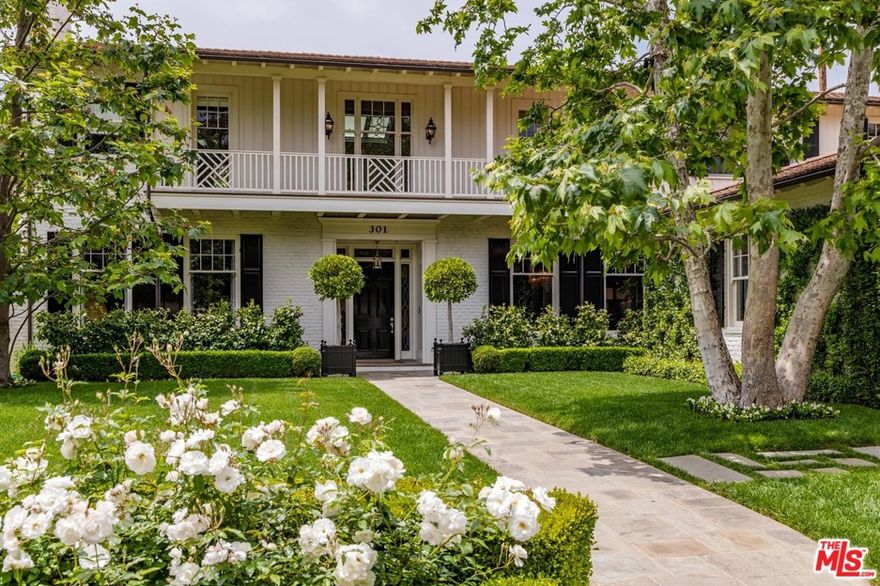 Seller wishes not to receive any soliciting calls! Behind gates covered in white roses lies this stunning traditional by revered architect Stephen Giannetti. Classical architecture with a youthful and modern interior, this private estate is unassuming from the street. Walking up the path to the front door, thoughtful landscape lines the perimeter of the property. Upon entering, the grand the two-story foyer is surrounded by the formal dining room, billiard room/library, alluring bar and an elegant living room with French doors that open onto a veranda ideal for entertaining. The double island chef's kitchen with enormous butler's pantry is a dream for any chef and the two-story family room with over 20' ceilings is flooded with light. Upstairs there are 4 en-suite guest rooms, an upstairs kids lounge, gym and a generous master suite with his/her baths and separate closets. The expansive and private backyard includes a guest house with fireplace and a sparkling pool and spa.