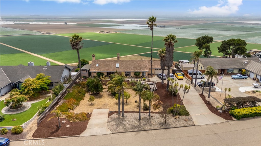 Welcome to this beautiful 2,400 sq. ft. home nestled in the serene bluff of Nipomo. This spacious 3-bedroom, 2-bathroom residence offers a harmonious blend of comfort, style, and natural beauty—with sweeping panoramic views of the lush crop fields in the valley below.
Step inside to find durable and elegant tile flooring throughout, enhancing both aesthetics and easy maintenance. The expansive great room is a true centerpiece of the home, featuring a striking three-sided fireplace that adds warmth and ambiance from every angle—perfect for entertaining or relaxing.
The well-designed primary suite offers a private retreat with a cozy fireplace, creating the perfect atmosphere for winding down. The suite also features a generously sized walk-in closet and a luxurious en-suite bathroom with dual vanities and a spacious walk-in tiled shower.
Outside, the natural beauty of the surrounding agricultural landscape creates a sense of peace and open space, offering breathtaking sunsets and a unique connection to Nipomo’s rural charm.
Don’t miss the opportunity to make this exceptional view property your home—where privacy, space, and scenery come together in one perfect package.