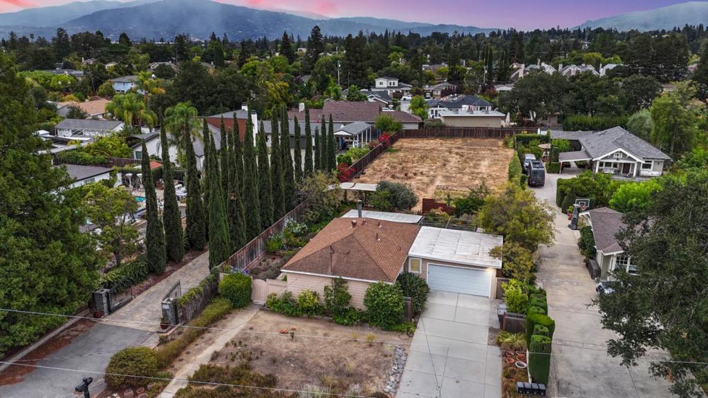 Location, land & limitless possibilities await! This property features a charming single-family cottage set on an expansive half-acre lot in one of West Campbells most desirable neighborhoods. Whether youre looking to create your dream estate, expand and rebuild, or pursue a potential lot split for a multi-home development, the possibilities are numerous. The existing home offers a cozy and functional floor plan with 3 bedrooms, 1 bathroom, an updated kitchen, hardwood flooring, and an attached two-car garage, making it move-in ready while you plan your vision. Step into the backyard and youll find an eclectic garden and a vast open field that could be reimagined as a personal retreat, urban farm, or future development site. This prime Campbell location places you close to top-rated schools, vibrant downtown Campbell, shopping and dining destinations, and major employers throughout Silicon Valley. With its unbeatable combination of land, location, and potential, this property is a rare find for homeowners, investors, and developers alike.