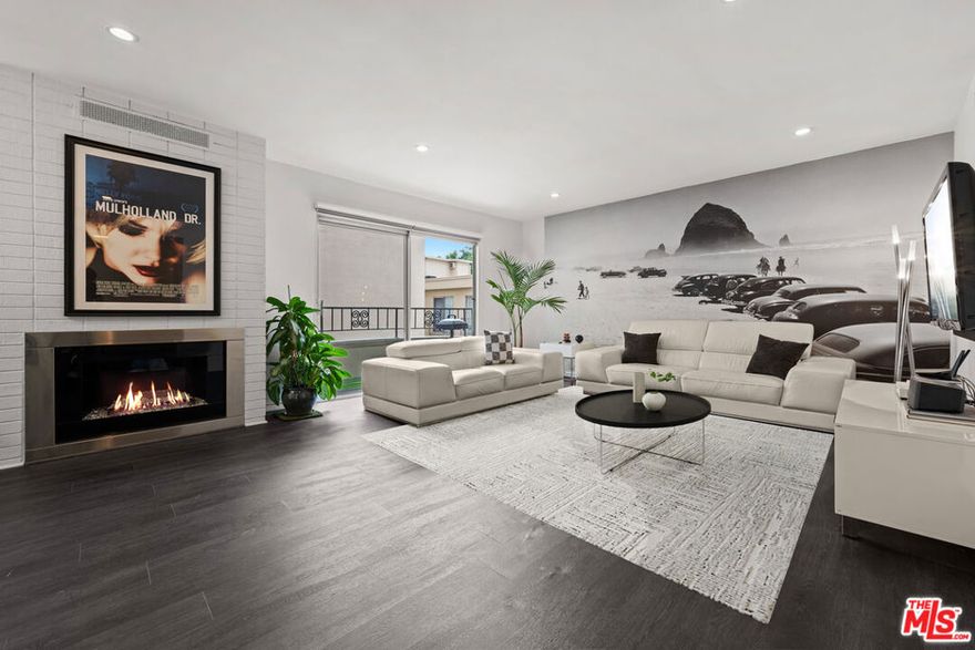 Welcome to Unit 207 in Kingswood Court, ideally located in one of the most desirable neighborhoods in LA, moments from Santa Monica Blvd and the Sunset Strip. This light and bright 1 bed, 1 bath corner unit condo spans a generous 945 square feet and offers an open living area with a fireplace, dining room, galley kitchen and private balcony. Updated with modern finishes throughout and several recent upgrades including recessed lighting, a Miele in-unit washer and dryer, and a renovated bathroom with a separate shower and bath. The condo comes with one assigned parking space in a secured parking garage. Located in a well-maintained building with a secured Butterfly entry system, updated lobby, and a new pool and spa deck. The epitome of West Hollywood living!