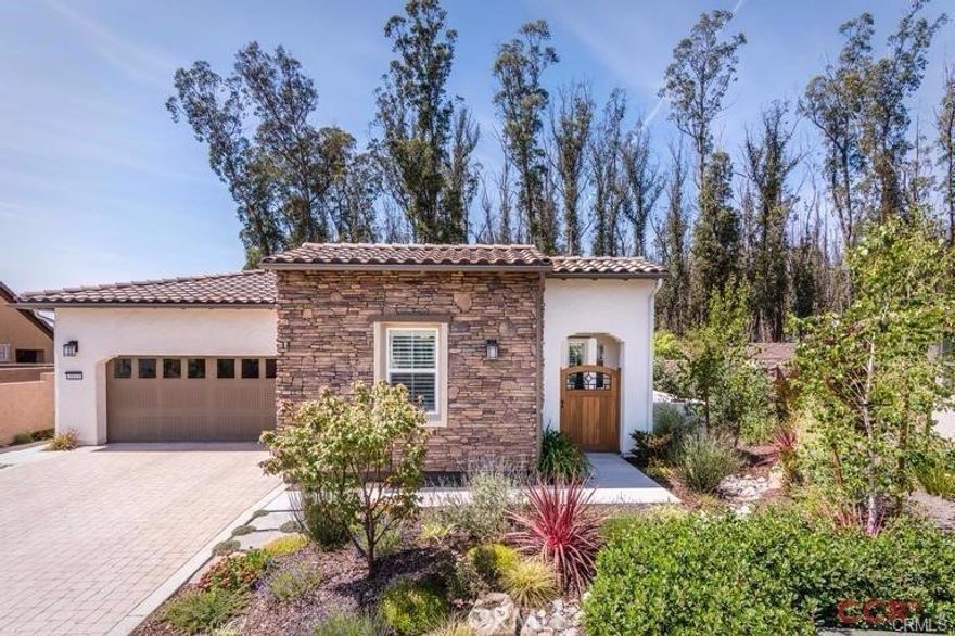 Spectacular Genova model located on a quiet cul-de-sac in the coveted Trilogy Monarch Dunes Resort Community. From the moment you arrive, the elegant stone-accented exterior and gated courtyard entry set the tone for this exceptional home. Featuring 3 bedrooms—including a private-entry casita ideal for guests. Ideally located on a spacious pie-shaped lot, backing to lush, private greenbelts, offering a tranquil setting and seamless indoor-outdoor living. The professionally landscaped backyard offers a peaceful and thoughtfully curated outdoor retreat, featuring a covered patio with fireplace, raised garden beds, dry riverbed features, artificial turf, vibrant flowers, and fruit-bearing trees. Inside, you'll find beautiful flooring, upgraded kitchens and baths, an oversized "smart space" utility room and sophisticated finishes throughout. Thoughtful upgrades include prepaid solar, whole-house water filtration, custom window treatments, ceiling fans, stone countertops, a tankless water heater, a side-yard warm-water dog wash spigot, and a dramatic sliding wall that opens to the outdoor living space. This rare offering blends luxury, privacy, and nature in one stunning home—schedule your showing today!  PICTURES ARE NOT CURRENT! UPDATED PHOTOS COMING SOON.