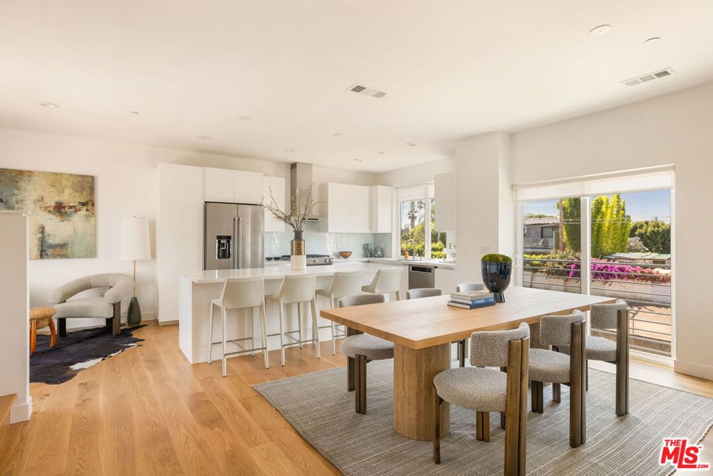 An architectural sanctuary on a hidden cul-de-sac, this spacious single-family home, of over 2,000-square feet, has four bedrooms plus three-and-a half baths with an attached two-car garage. Abundant natural light dances across the spaces with dynamic city views out of every side of the home. Downstairs is perfect for a home office or in-law/teenager suite complete with a private ground floor garden and patio space. On the second level, the open eat-in kitchen, with stainless steel appliances, plus a gracious dining and living area allows for seamless entertaining and has an outdoor deck for grilling. The third floor master suite has an oversized-closet and generous master bathroom. Two more bedrooms with a shared bath and a large soaking tub, plus laundry, complete the top floor. With wide plank oak hardwood floors throughout, abundant storage, central air and heat, energy-efficient tankless water heater, a ring home security system, plus pre-wired for solar and electric car charging, this urban oasis, just minutes to Culver City, Venice, Playa Vista, and Marina del Rey with easy access to 405 freeway, has the highest quality, best value and a unique community not available anywhere on the westside of Los Angeles. BY APPOINTMENT ONLY.