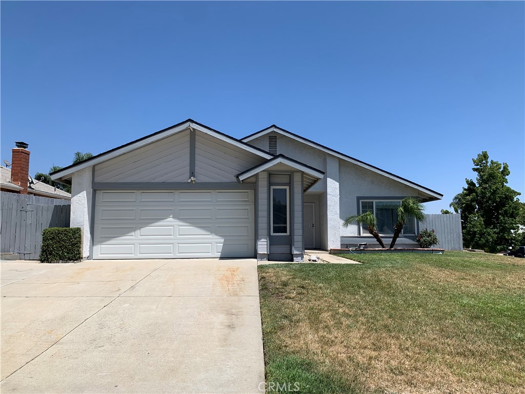 Welcome to your new cozy and inviting home in a great neighborhood! This home is ready for its new family to enjoy with fresh paint throughout! When you walk in you're greeted with a bright living room with natural light coming in from the big window in front. Down the hall you will find the first bathroom and two bedrooms. At the end of the hall you will find the primary bedroom with a primary bathroom. Near the kitchen is the family room with a fireplace and dining area. There is a sliding glass door in the family room that leads out to the backyard. The backyard features an attached patio, raised garden beds along the side of the yard and has grass with a sprinkler system. On the other side of the yard there is an area that is fenced off and could be used as a dog run, another garden or to add on to the home. The backyard has a wooden fence all throughout for privacy. The two car garage is attached to the home and has a laundry hook up area. The home has a new roof that was put in just three months ago! Come see your new home today!