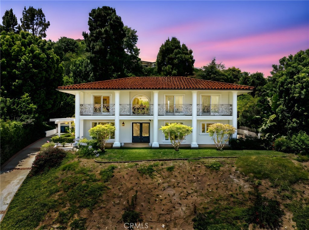 Perched at the top of a serene cul-de-sac in prestigious Miraleste Hills, this majestic 4-bedroom, 3-bathroom residence captures sweeping ocean and harbor views from almost every room in the house. Surrounded by mature trees and lush landscaping, the home offers a rare sense of privacy and seclusion.
Inside, a spacious and elegant living room sets the tone for the rest of the home, flowing effortlessly into a formal dining room—perfect for hosting family and friends. The bright, open-concept kitchen is a chef’s dream, appointed with rich cabinetry, gleaming granite countertops, and stainless steel appliances. Just off the kitchen, the inviting family room features a cozy fireplace and built-in wet bar—an ideal setting for entertaining or relaxing evenings at home.
A stylish powder room completes the main level, while upstairs you'll find four generously sized bedrooms and two well-appointed bathrooms. The expansive primary suite offers a walk-in closet with custom built-ins, an ensuite bath with a soaking tub and separate walk-in shower and an opportunity to soak in fresh ocean breezes and stunning vistas from your balcony. Comfort is ensured year-round with central air conditioning, and practical amenities include a full laundry room, attached two-car garage with storage, and ample additional parking.
Designed for seamless indoor-outdoor living, the home features patios off both the kitchen and family room—ideal for al fresco dining or enjoying peaceful evenings under the stars. The beautifully manicured front lawn invites you to relax with a glass of wine while taking in the panoramic coastal scenery. This is Southern California living at its finest—peaceful, private, and just moments from top-rated schools, shopping, dining, and coastal attractions. With no power lines blocking your view and the fire department just minutes away don’t miss this exceptional opportunity to own a property in one of the Palos Verdes Peninsula’s most coveted neighborhoods.