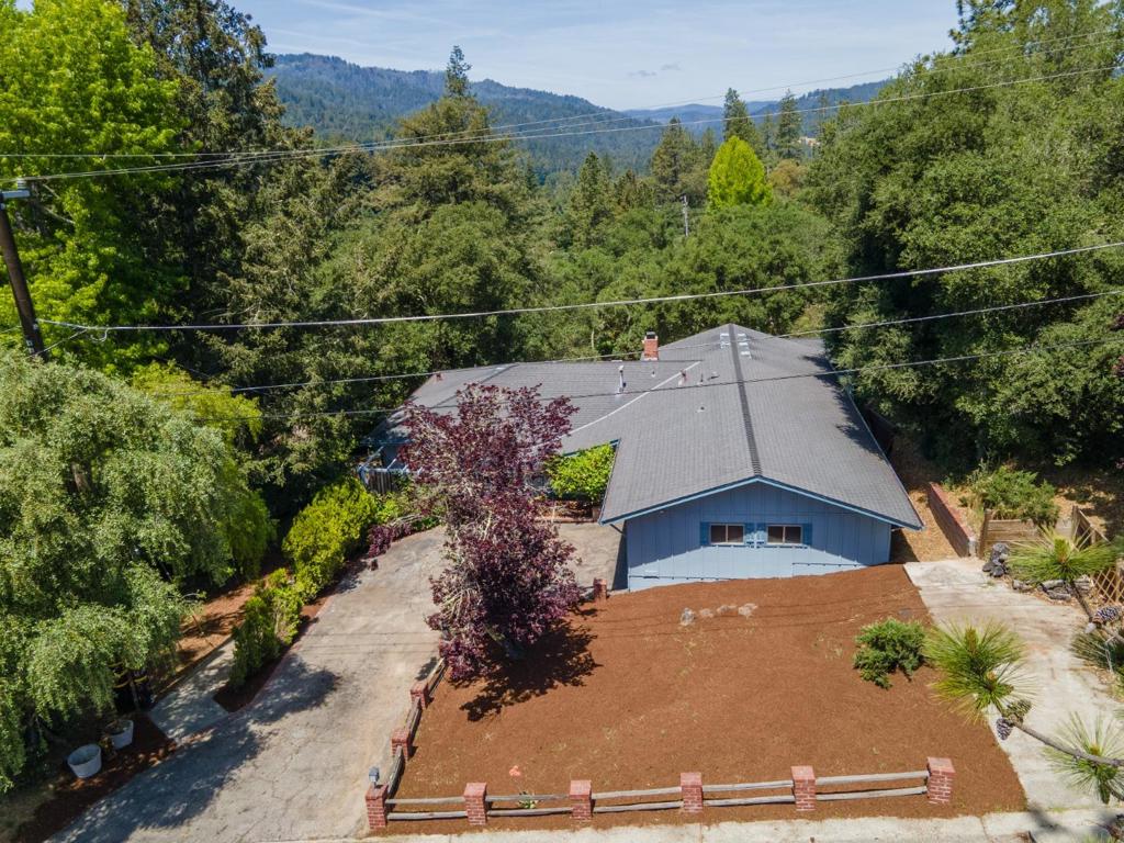 Nestled among the trees in a serene and quiet neighborhood, this expansive five-bedroom, three-bath home offers the perfect blend of privacy, space, and natural beauty. Large picture windows frame stunning wooded views, filling the home with soft natural light and creating a peaceful retreat-like atmosphere. The thoughtful floor plan provides generous living areas, perfect for both entertaining and everyday comfort. Upstairs, youll find bright, airy bedrooms and tastefully appointed bathrooms, while the main living spaces showcase an open flow with warm finishes that highlight the surrounding natural landscape. Downstairs has a private 2 bedroom 1 bath area with private entrance for an ADU if desired. Step outside to enjoy tranquil outdoor areas ideal for relaxing or hosting gatherings. Set in one of the areas most desirable communities, this home offers not only a spacious lifestyle but also the comfort of being part of a truly sought-after neighborhood.