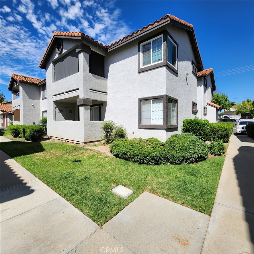 Updated Affordable Turnkey Corner Unit Condo in a Gated Community – Move-In Ready! Seize this rare opportunity to own a beautifully updated 2-bedroom, 2-bath upper corner-unit condo that blends modern comfort with unbeatable convenience! Nestled in a secure, gated community, this second-floor gem offers the perfect balance of tranquility and proximity to vibrant amenities. Step inside and be captivated by the spacious, light-filled family room that flows seamlessly into the dining area, ideal for entertaining or cozy nights in.The beautifully updated kitchen boasting sleek granite countertops, a stylish breakfast bar, and stainless steel appliances, including a stove, dishwasher, and refrigerator. Start your mornings with a breathtaking sunrise on your private balcony, perfect for sipping coffee or unwinding after a long day. The primary suite is a true retreat, featuring soaring vaulted ceilings and a private bath, thoughtfully separated from the equally spacious second bedroom with its own vaulted ceiling and adjacent full guest bath. Freshly updated with a brand-new heat and A/C compressor, this home is ready for you to move in and start living your best life! Enjoy resort-style living just steps from the sparkling pool, relaxing spa, and vibrant recreation room. Additional highlights include in-unit laundry, a mix of elegant tile and carpet flooring, a private one-car garage with remote roll-up door, and an extra dedicated parking space for ultimate convenience. The HOA covers select utilities and hazard insurance, keeping your costs low and your lifestyle carefree. Perfectly situated near parks, schools, shopping, outlet centers, dining, serene lake access, and easy freeway connections, this condo offers the best of both worlds: a peaceful retreat with everything you need just minutes away. Don’t miss your chance to own this move-in-ready affordable gem – schedule a tour today and make it yours!