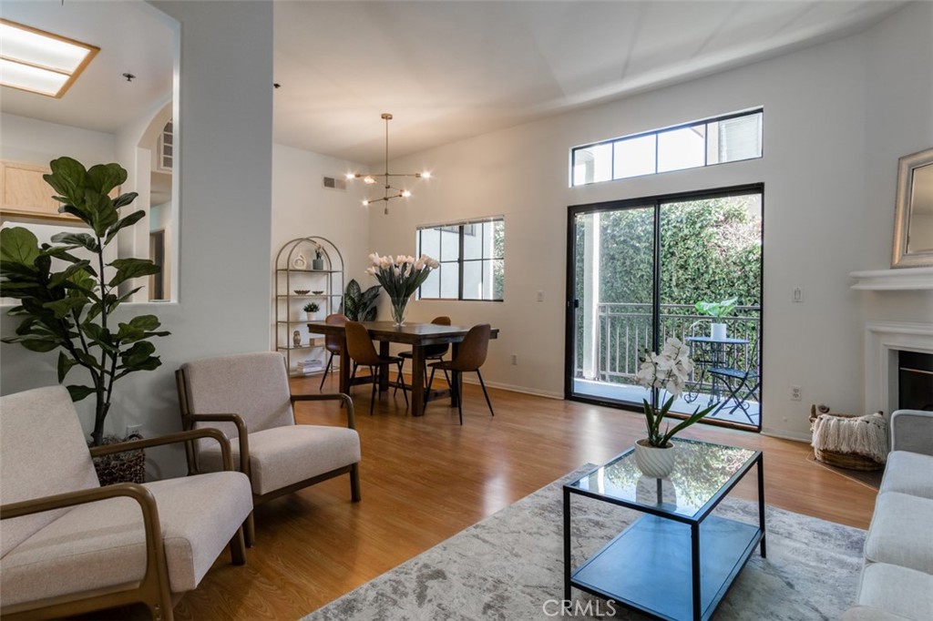 Stylish Serenity in the Heart of Pasadena
Welcome to your own peaceful retreat just moments from the vibrant energy of Old Town Pasadena. Tucked away in a quiet, beautifully maintained complex, this sophisticated ground-floor condo blends charm, comfort, and convenience in one delightful package.
Step inside to a spacious open-concept living and dining area with rich wood-style flooring, soaring ceilings, and abundant natural light. The cozy fireplace and private patio, create the perfect space for both relaxed mornings and charming evenings.
The kitchen is light and functional, offering warm wood cabinetry, expansive tiled countertops, and a layout ideal for home cooking and entertaining alike. A thoughtful separation between the living spaces and bedrooms adds to the sense of comfort and privacy.
The primary suite is a tranquil haven with dual mirrored closets and a beautifully appointed en-suite bath featuring double vanities, and separate shower. A second bedroom and adjacent full bath offer flexibility for guests, a home office, or creative space.
Accessibility is a breeze with both an elevator and staircase leading to the garage, where two side-by-side assigned parking spaces await. Enjoy added peace of mind with HOA coverage for water, trash, and landscaping.
Experience the relaxed vibe and unmatched convenience of this Pasadena
gem, located just blocks from Lake Avenue, The Paseo, and Cal-Tech.
Discover your new home today!