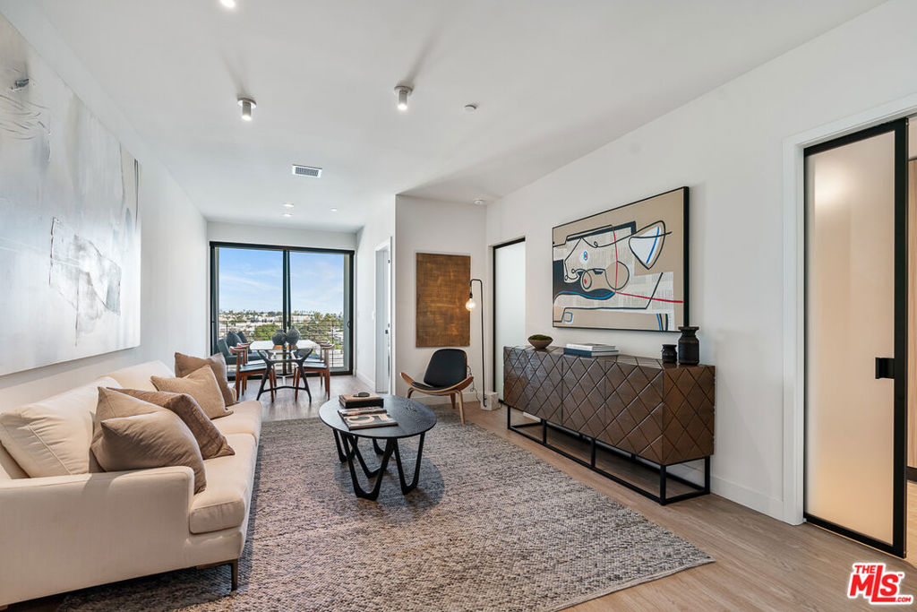 Venue Residences by Helio. This beautiful 1 bed + 1 bath is the A-layout available on the 5th floor, West facing. Kitchen has unique dark finishes with stained granite counters, matte black fixtures, and stainless steel Beko appliances. The open living and dining concept allow for a good flow of the space, as well as access to a large balcony for comfortable outdoor lounging. The bedroom has a large window, built in lighting and a remote controlled ceiling fan. From here you walk into the highlight of this layout which is the walk-through dressing room with beautifully custom made closets, a large built-in mirror, and adjustable lighting. The bathroom has ample counter space, a wall-to-wall mirror, standing shower with a rain shower head, separate bathtub, and a linen closet. Property amenities include: Fitness center, 2 rooftop lounges with heated dipping pool, co-working spaces, conference room and front desk staff. Parking is $150/month for a single space, and internet $84/month. Please note photos are not of exact unit; views will vary. Tours are available by appointment, so please contact us today.