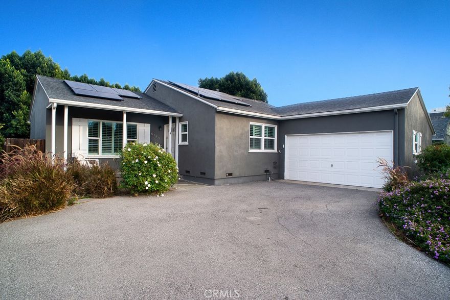 Prime Woodland Hills location just steps from The Village, Westfield Topanga Mall, and Warner Center. This updated 3-bedroom, 3-bath single-family home sits on a quiet street and features great curb appeal, an open floor plan with family room and kitchen/breakfast bar, quartz countertops, stainless steel appliances, and a bright interior. The primary suite offers French doors opening to a covered patio and low-maintenance backyard ideal for entertaining. Upgrades include new windows, French doors, recessed lighting, fresh interior and exterior paint, refinished original hardwood floors, attached two-car garage, landscaped grounds, and Solar Panels for REDUCED electric bills!