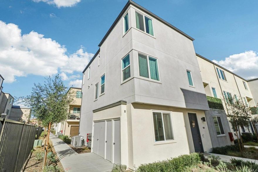 Welcome to 1650 Waterside Dr #129, a spacious and thoughtfully designed 4-bedroom, 3.5-bath residence offering 1,946 square feet of modern living in the desirable La Brisa community of San Diego. This light-filled home features upgraded lighting throughout, sleek quartz countertops, and stainless steel appliances that complement the open and functional layout.  A highly desirable first-floor bedroom and full bath provide flexibility for guests, multigenerational living, or a private home office, while the remaining bedrooms are conveniently located on the third floor for added privacy. Enjoy the benefits of paid-off solar, helping reduce energy costs and enhance efficiency.  Ideally situated near shopping, dining, parks, and major commuter routes, this low-maintenance home offers comfort, convenience, and smart design in a well-maintained community perfect for today’s modern lifestyle.