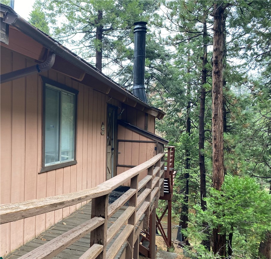 Back in Market. Welcome to your charming mountain retreat, nestled in the heart of San Bernardino National Forest, Twin Peaks! Just a few minutes drive to Lake Gregory and Lake Arrowhead. It is the perfect place outside the big city to a breath of fresh air, surrounded by pine trees. Mountain living in style. The main floor has high beam ceilings, expansive windows with amazing views that lead to your private balcony; and a cozy wood-burning stone fireplace that adds warmth and charm. Feel at home with the 2 bedrooms and one bath on the main floor offering spacious and comfortable accommodations perfect for families and guests. Both rooms have lots of storage. This home is equipped with a full kitchen. It features a new countertop, new refrigerator, trash incinerator and new gas stove with air fry option. The cabin is fully furnished with furniture, bedding and accessories. Brand new centralized forced air gas heater on the main floor, and new gas water heater installed. Generator, wood splitter, gas chainsaw and many other accessories to make your mountain living complete. Beneath the house, is an additional open space that you can use as another room, storage or workshop. It has a large bathroom. There are 2 private decks to enjoy, great for entertaining on those warm summer nights. The yard is perfect for snow play during winter. This cabin has 2 large parking spaces. You will enjoy walking in the beautiful surrounding, hiking and biking in this welcoming community of Twin Peaks. All appliances and most furnitures included.