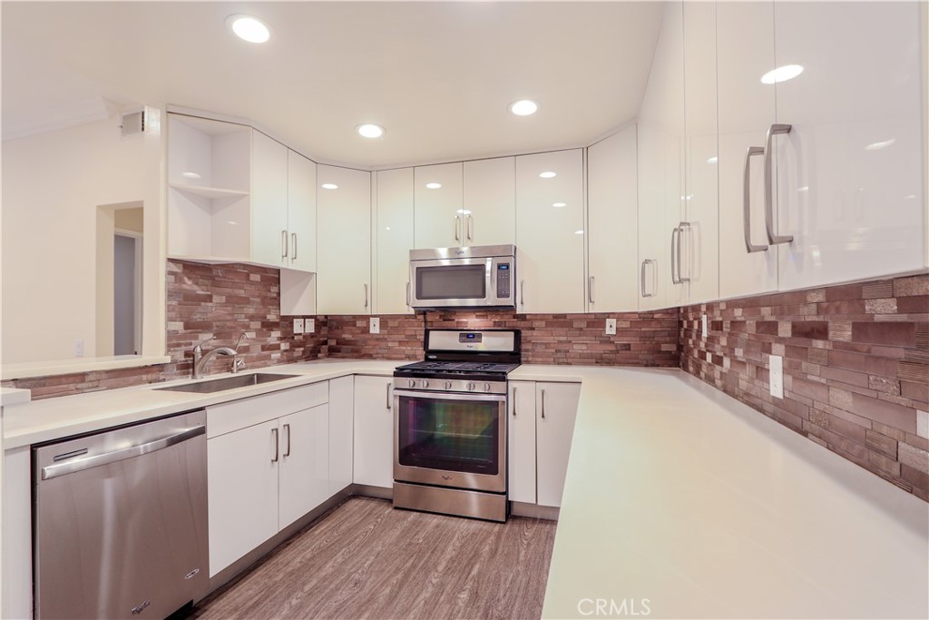 Introducing this beautifully remodeled two-bedroom, two-bath condominium located in a highly sought-after neighborhood. This bright lower-level unit offers a multitude of exceptional features and modern upgrades, making it the perfect place to call home. Fully Remodeled Kitchen, Enjoy a spacious culinary space complete with custom-made cabinetry and contemporary finishes. Living Room, The inviting living area features elegant hardwood flooring and abundant natural light. Both bedrooms are generously sized, with two full bathrooms designed for privacy and convenience. A washer, dryer, and refrigerator are provided, ensuring a seamless move-in experience. Cozy Patio, Step outside into a charming patio area perfect for morning coffee or evening relaxation. Benefit from an attached garage and unlimited open parking for guests. Resort-style facilities, two community pools, and spas offer a relaxing oasis for residents, ideal for unwinding after a long day. Scenic hiking trails and bike paths are located nearby, catering to outdoor enthusiasts. Conveniently situated in a thriving area, the condominium provides easy access to shopping centers, dining establishments, and entertainment venues. Major highways and public transportation options are also close by, ensuring a streamlined commute. With its thoughtfully designed interior, tranquil outdoor spaces, and an array of community features, this condominium presents
a unique opportunity for comfortable living. Whether you are a first-time homebuyer, downsizing, or seeking an investment property, this residence is sure to
exceed expectations. Do not miss the opportunity to make this remarkable condominium your new home. Contact us today to arrange a private viewing and
experience all that this residence has to offer.