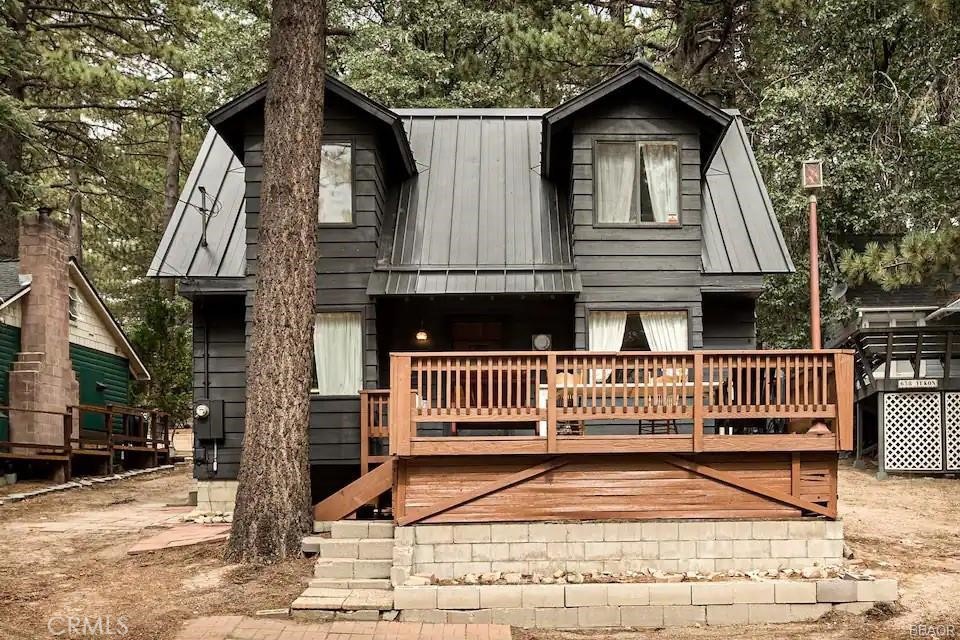 Price Reduction! Welcome to your cozy mountain retreat! Great and wonderful and ready to move in, on a level lot of over 7500sf. Cabin offers abundant possibilities for mountain living throughout each of the four seasons, this cabins offers an open concept dining and living area with beautiful wood accents. Livingroom offers a cozy brick fireplace for those Snowy winter nights in Green Valley Lake. Property offers ample level parking for several cars, owner have just completed a new metal roof, new wood flooring and a large front deck for entertaining during the warm summer months. Green Valley Lake offers a private Lake great for boating, fishing and swimming with miles of hiking and biking trails.