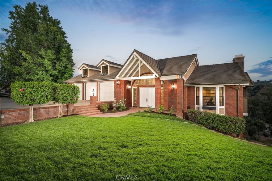 Welcome to 1187 Edinburgh Road, an extraordinary, beautifully remodeled estate nestled at the end of a serene cul-de-sac on an expansive 3.5-acre lot in the hills of San Dimas. With breathtaking mountain and city lights views, a private creek, and zoned for horses, this one-of-a-kind property offers a rare blend of seclusion, elegance, and versatility. A long, private driveway lined with split-rail fencing and mature trees leads to this impressive 5-bedroom, 4-bathroom estate boasting 4,085 sq ft of thoughtfully designed living space. The charming brick front porch and grand double-door entry welcome you into a bright formal entry with soaring ceilings and an abundance of natural light. The main level features a formal living room with a cozy fireplace, French doors, and a balcony offering panoramic views, a spacious formal dining area perfect for entertaining, a newly remodeled chef’s kitchen with white cabinetry, quartz countertops, stainless steel appliances including a built-in refrigerator, a kitchen nook with stunning views, a large family/great room with beamed ceilings, built-ins, a cozy second fireplace, access to the scenic balcony, and one spacious bedroom and one bathroom with shower, ideal for guests or multi-generational living. Downstairs, retreat to the luxurious primary suite complete with private balcony access, a walk-in closet, and spa-inspired bathroom featuring dual sinks, a soaking tub, and a large walk-in shower. Two additional bedrooms with hillside views, a full bathroom with dual sinks, and a flex space ideal for a game room or home gym complete the lower level, along with a dedicated laundry room.

Additionally, a detached 5th bedroom with en-suite bath and private entrance offers endless potential—perfect for a home office, studio, guest suite, or college student. Outdoor highlights include an expansive flat lawn and lush landscaping, horse property with ample space for equestrian amenities, three car attached garage with epoxy flooring, potential for RV parking or additional garage, and dual success from Scarborough Lane. 

Whether you're looking for tranquil country living or a turnkey entertainer's dream, this estate delivers the best of both worlds—all within minutes of schools, shopping, and freeway access. Don’t miss the opportunity to own this truly unique San Dimas gem.