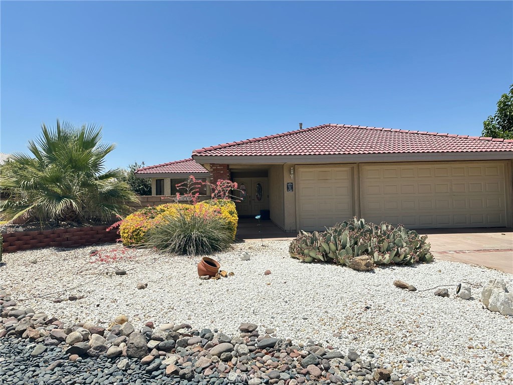 Lakefront Living at Its Finest in Silver Lakes! Well-maintained lakefront home located on a channel in the Silver Lakes community, nestled between Barstow and Victorville in the peaceful high desert town of Helendale. Since ownership, the kitchen and master bathroom have been remodeled, adding to the home's comfort and functionality. The open floor plan features spacious living and dining areas, a stone fireplace, wet bar, and a large, covered patio with stunning lake views—ideal for both entertaining and everyday living. Additional features include tile flooring, quality window coverings, ceiling fans, and a landscaped front courtyard. Silver Lakes offers an exceptional lifestyle with amenities including a 27-hole PGA-rated golf course, two private lakes for boating and fishing, a beach and boat launch area, clubhouse, fitness center, tennis and pickleball courts, RV parking, and an equestrian center. This lakefront property combines comfort, space, and access to resort-style amenities in a welcoming and well-kept community. (More photos & video coming soon)