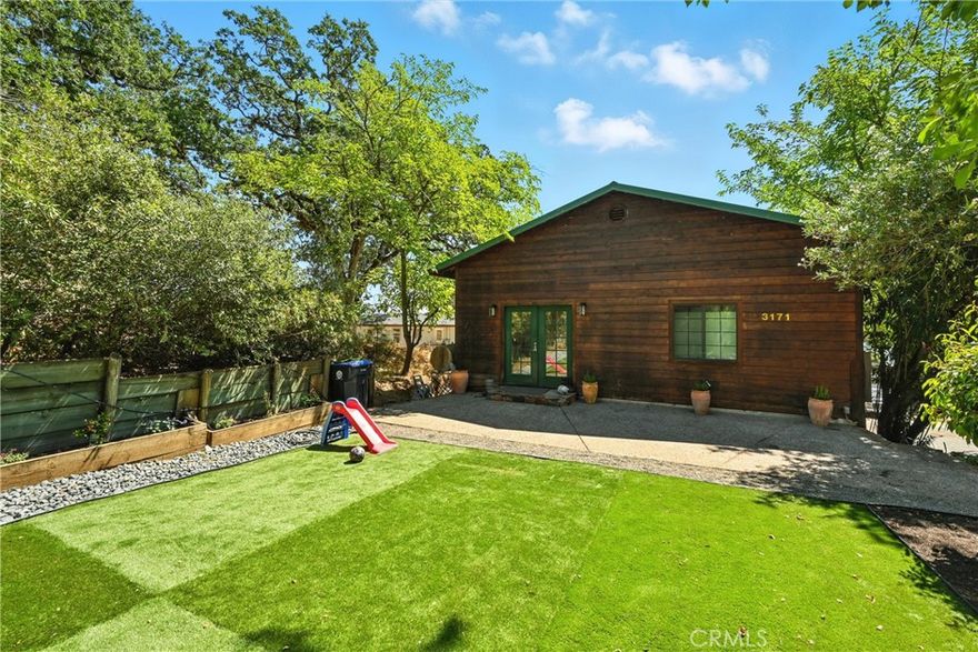 Welcome to a home designed with entertaining in mind! From the moment you arrive, you’ll notice the expansive driveway offering room for 10+ vehicles—perfect for gatherings, holidays, or simply having plenty of space for your toys. The garage is 2-1/2 cars so there is room for a workshop, and it features oversized rollup doors; there also is a single carport for an extra covered parking space. Whether you need room outside or a boat, RV, or multiple cars, this property has the flexibility and parking capacity to make it easy.Step inside to a spacious main level that flows beautifully for hosting family and friends. The large kitchen has movable island and pantry, ideal for preparing meals. Serving big groups is a cinch in the dining area which has room for a long dining table. The adjoining living room with an open beam ceiling creates a warm, welcoming space to gather. A generous deck just off the living room provides beautiful lake views and a perfect place for morning coffee, evening sunsets, or entertaining outdoors. This thoughtfully designed home offers convenience with a main-level bedroom and full bathroom—great for guests, multigenerational living, or anyone who prefers fewer stairs. Downstairs, you’ll find a private primary suite featuring ample closet space and an en-suite bathroom. Another comfortable bedroom and a laundry room complete the lower level, ensuring practicality and privacy for everyday living. Adding to its value, this home is equipped with a durable metal roof built to last for decades, reducing long-term maintenance worries. Every detail is oriented toward functionality and ease, while still creating a warm and inviting atmosphere. Located within an easy commute to Ukiah, this property offers the best of both worlds: convenient access to town for work, shopping, and amenities, but without the higher Ukiah price tag. It’s a fantastic opportunity to own a versatile, entertainment-ready home with space to spare—inside and out. If you’ve been searching for a property that blends livability, durability, and plenty of room to host friends and family, this is it. Don’t miss the chance to enjoy lake views, generous parking, and a welcoming floor plan in one of the area’s most accessible locations.