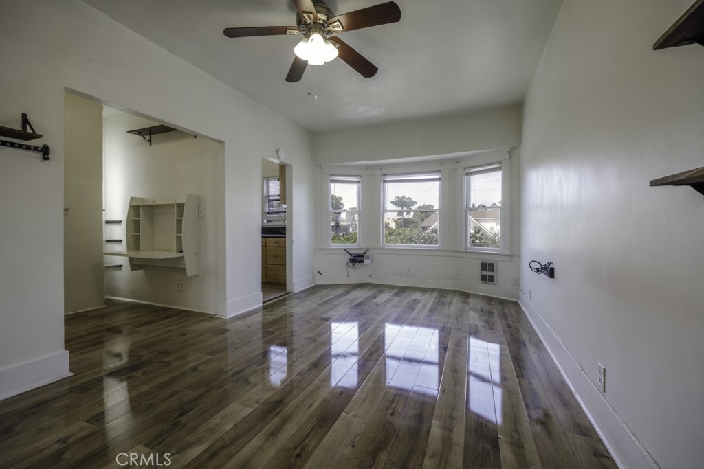 Charming top floor “Own your Own” studio available in the Downtown area. Plenty of storage, lots of natural light. UNIT COMES WITH ALREADY ASSIGNED PARKING SPACE IN THE LOT NEXT TO BUILDING WHICH BUYER CAN REQUEST TO KEEP THROUGH HOA. Large mirror doors closet, a functional work area with a built-in wall desk where you can study or work from home. Low HOA fees include all utilities except electricity. Great Location. Close to Pine Ave, restaurants, coffee shops, entertainment, grocery stores, near the Blue Line heading towards Los Angeles and easy access to 710 freeway and much more.