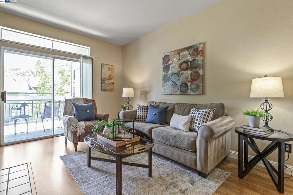 Welcome to this well-maintained 1st-level condo in the highly sought-after Canyon Meadows community. This home features a clean original condition with a bright, open floor plan, a cozy wood-burning fireplace, and a private balcony that backs to the greenbelt with serene views, and an updated bathroom. The unit includes a detached 1-car garage along with an additional parking space in front of the garage, and ample visitor parking for added convenience. Enjoy resort-style living with HOA amenities that include two pools, a spa, tennis courts, basketball and volleyball courts, a clubhouse with gym, car wash area, and water and heated water included in HOA dues. Located within the award-winning Pleasanton school district, and offering easy access to major commuter routes, BART stations, shops and restaurants, this condo is priced below comps—don’t miss this incredible value!