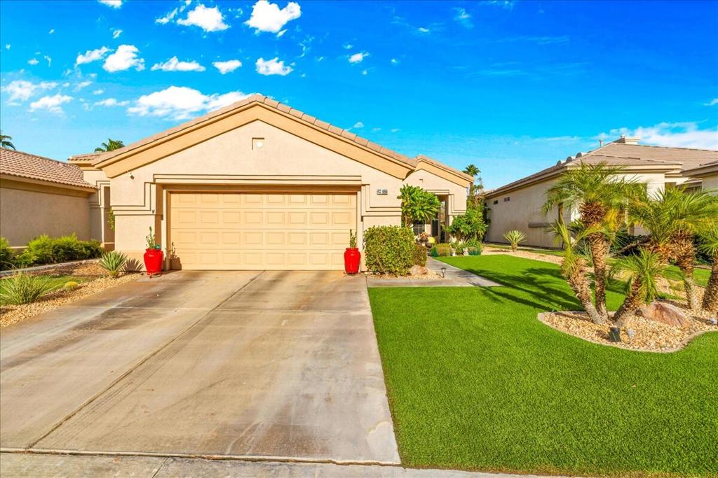 Beautifully maintained condo in the guard-gated 55+ Heritage Palms Country Club, featuring updated hardwood-style floors, epoxy-finished patio and garage, and a bright open layout with a modern kitchen, stainless appliances, large pantry, and cozy breakfast nook. The primary suite offers a walk-in closet, dual sinks, and oversized shower, while the second bedroom and versatile office space (converted from the laundry room) add flexibility. Complete with an attached two-car garage, this home is just steps away from resort-style amenities including golf, clubhouse, restaurant, gym, tennis, and indoor/outdoor pools.