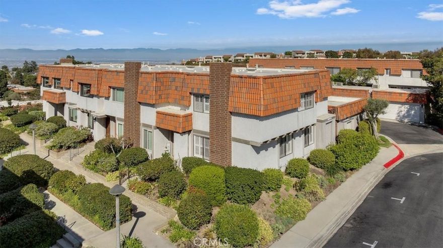 Located in the coveted Ridgegate gated community in the heart of Rancho Palos Verdes, this beautifully remodeled three-bedroom, three-bathroom townhome blends contemporary comfort with timeless style. Positioned at one of the highest points in the complex and as an end unit, the home enjoys exceptional natural light and a quiet, private setting. The inviting living room opens seamlessly to the dining area, accented by a built-in wet bar that makes entertaining easy. The remodeled kitchen features stainless steel appliances, sleek cabinetry, and a sliding glass door leading to a private patio, perfect for relaxing or dining outdoors. Upstairs, the spacious primary suite offers dual closets and a tastefully updated en-suite bathroom. Two additional bedrooms and a full hallway bath complete the upper level. Thoughtful upgrades throughout the home include a remodeled kitchen and bathrooms, engineered wood flooring, newer HVAC system and water heater, and updated appliances, all enhancing both comfort and style. Additional features include direct garage access and a private backyard patio. The gated community provides resort-like amenities including swimming pools, tennis and paddle tennis courts, sports courts, and beautifully maintained landscaped grounds overseen by on-site management and maintenance staff.

Ideally located within the award-winning Palos Verdes school district and just moments from shopping, dining, and scenic parks, this home offers a rare combination of modern living, privacy, and convenience in one of Rancho Palos Verdes’ most desirable communities.