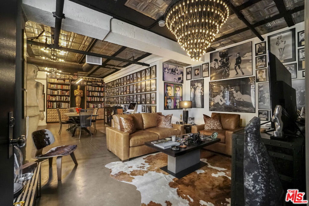 Step into the heart of old Hollywood glamour with this stunning, move-in ready loft in the full-service building. Amenities offer the best in luxury living with 24-hour doorman service, valet parking, and access to a panoramic rooftop lounge featuring a fire pit and BBQ. A rare opportunity to own a piece of LA's cinematic history. The unit is located in a building which has been designated as a Historic-Cultural Monument and is covered under the Mills Act. This spacious loft offers dramatic, soaring windows (with included shades) flood the space with natural light and showcase captivating city views. Chef's kitchen with stainless steel Viking appliances, a spacious sleeping area with generous closet space, window with shades plus an in-unit washer and dryer for ultimate convenience. Live just steps from the Walk of Fame, theaters, fine dining, the Metro Red Line, and shopping. This is elevated loft living in the heart of Hollywood's most legendary location.