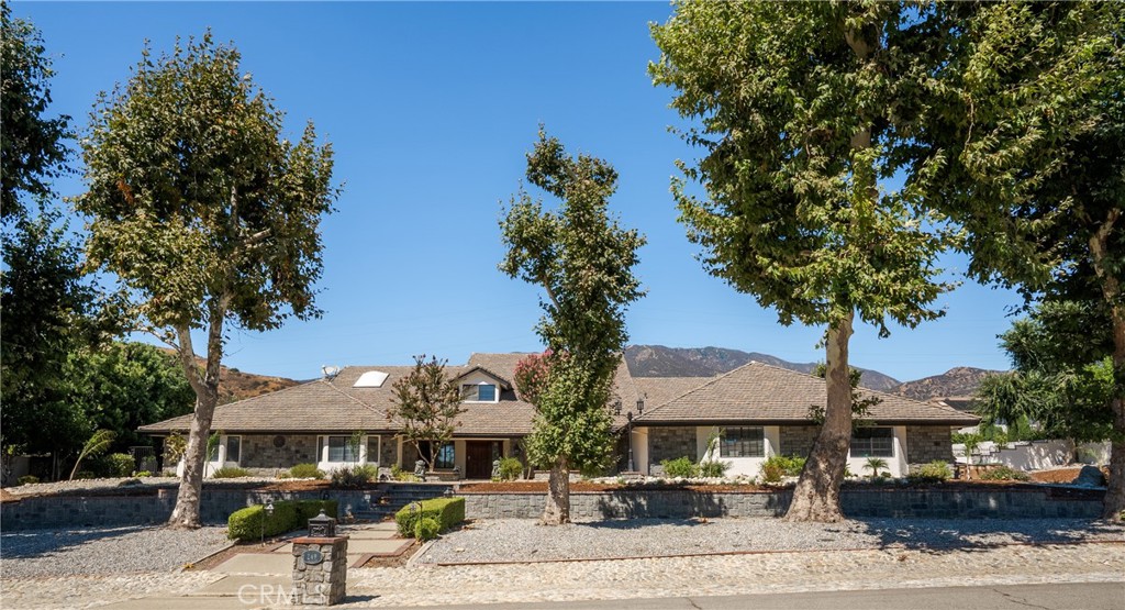 This beautifully remodeled home in North Claremont offers five spacious bedrooms and four bathrooms, perfectly designed for comfort and style. Situated on a large lot, the home features an oversized family room with a cozy fireplace and a built-in bar—ideal for entertaining. The house offers natural lighting throughout. The kitchen is all new with shaker cabinets and new appliances. All bedrooms have an ensuite bath, ample closet space. The primary bedroom offers a fireplace, two massive closets, French doors overlooking the pool area, and a peaceful fountain outcove. Upstairs, you’ll find a private library, a versatile loft bonus room, a yoga studio, and a fifth bedroom, perfect for guests or a home office. The backyard is ready for entertainment with a sparkling pool, spa, and BBQ area. A rare 6-car garage provides plenty of space for vehicles, storage, or hobbies. Located just minutes from Claremont’s Village, which offers excellent dining, entertainment, and shopping. The Claremont Club and nature trails are close by. Top-rated schools and colleges, this exceptional home is now available for lease.