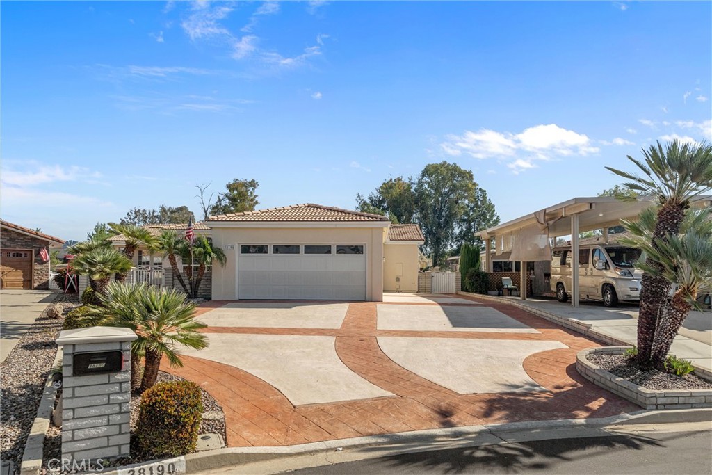 Enjoy breathtaking panoramic golf course views from this beautifully upgraded 2-bedroom, 2-bath home, perfectly positioned with 94 feet of golf course frontage in the highly sought-after Golf Knolls community in the heart of Murrieta.
This custom-built modular home showcases quality craftsmanship with 2" x 6" construction, vaulted ceilings, and newly installed luxury vinyl plank flooring. The light-filled interior offers two spacious living areas, a formal dining room, and an open kitchen ideal for entertaining. Additional highlights include a gas fireplace, skylights, plantation shutters, both electric and manual exterior window coverings, and a convenient indoor laundry room. It even includes a whole house filtration system.
Step outside to a full-length covered patio overlooking the golf course—perfect for morning coffee or evening sunsets—or unwind in the gated front courtyard featuring a tranquil water fountain. The property also includes a 2+ car garage and RV parking large enough to accommodate a 27-foot vehicle.
Residents of Golf Knolls enjoy resort-style amenities, including a clubhouse with pool, spa, fitness center, kitchen, and dining area, along with a full calendar of social events, group fitness classes, and travel excursions. Ideally located near the newly opened Murrieta Hot Springs Resort, shopping, dining, Temecula wineries, and easy access to both I-15 and I-215.