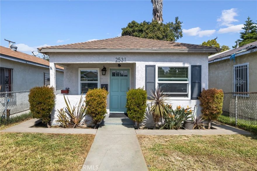 This Charming 2 bedroom, 1 bath home with a large backyard is perfect for the family looking to live in a Turn-key home now and expand & build later! This house was completely and tastefully remodeled in 2018 and refreshed in 2025 featuring newer windows, in unit washer / dryer, recessed lighting throughout, upgraded electrical panel, newer fencing, and did we mention a large 3,314 sq ft  flat lot big enough for another structure to be built! The back of the property has  a large iron security fence which offers plenty of added privacy , the lot offers plenty of parking, and is prime for private gatherings and functions!