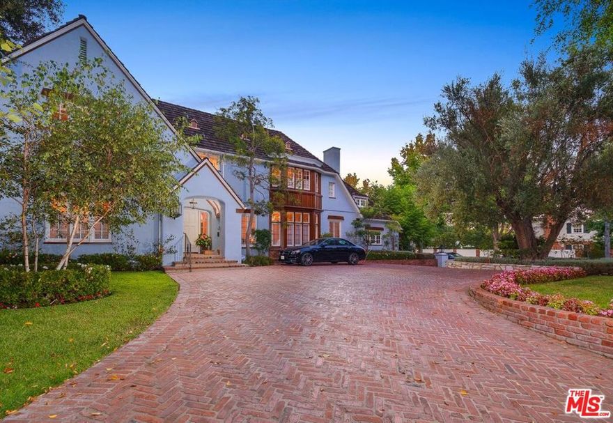 Iconic Country English in the heart of the Beverly Hills on arguably the best street in the flats.  5300 sq. ft. Country English home Reminiscent of the English countryside with grand scale rooms; large formal dining room, large formal living room, wood paneled library, hidden speakeasy Billiards room, garden room, large gourmet kitchen and breakfast room, maids and bath complete the main floor.  Upstairs is a sensational master suite with a large bath and fabulous closet space, 2 additional bedroom suites upstairs.  Fabulous yard with a large pool, outdoor shower, outdoor Dining and pergola with a fireplace, bonus room above the garage all on a 13,677 square foot lot.  Sensational flow for entertaining, true center hall plan, walls for artwork this is old Hollywood glamour at its  finest and all just minutes from Rodeo Drive shopping.  4 bedrooms, 5 1/2 baths