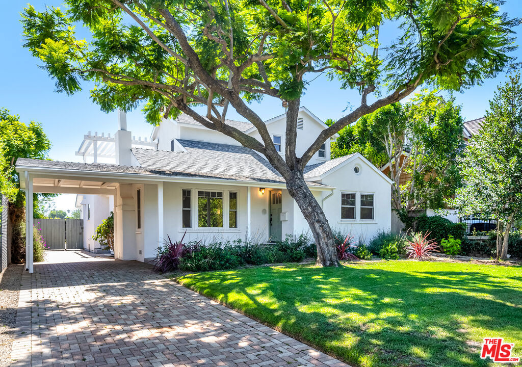 Welcome to 854 25th Street, an exquisite residence in Santa Monica, offering refined living in a prime location. This updated home features four bedrooms and three bathrooms spread over 2,182 square feet. The layout offers convenience and privacy with two bedrooms on each level, while an expansive upper-level balcony provides west facing tree-top views over looking Franklin Elementary. The heart of the home is its sophisticated kitchen, equipped with Viking appliances two ovens and dual dishwashers. Elegant bi-fold doors open the kitchen to the backyard, seamlessly integrating indoor and outdoor spaces, perfect for entertaining or enjoying the serene surroundings. Throughout the home, hardwood floors add warmth and character. Set on an 8,018 square foot lot, the property boasts landscaped front and backyards on drip and sprinkler system. The residence includes a two-car garage accessible from the alley, complemented by a long driveway leading to an additional one-car garage. This versatile garage, complete with windows and climate control, is perfectly suited for a home office or gym. Additional features include central air & Heat with bottom floor laundry room, ensuring comfort and convenience. Located just a stone throw from the vibrant Montana Avenue, this home provides easy access to upscale shopping and dining, offering a lifestyle of luxury and ease. In Franklin School district.