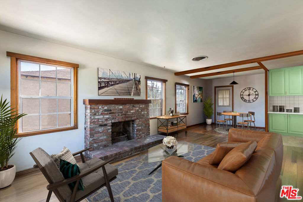 Incredible Opportunity in Sun Valley! A perfect starter home in a fantastic neighborhood, this 3-bedroom, 1-bath fixer-upper sits on a spacious 6,537 sq ft lot and is brimming with potential. On the market for the first time in over 75 years, the 1,008 sq ft home offers a functional layout with room to reconfigure or modernize, ideal for someone with a designer's eye to make it their own. Inside, you will find a bright living room that flows into the charming kitchen and dining area. Just off the kitchen, a huge enclosed patio expands your living space even further. Imagine family game nights, a playroom, home gym, or creative studio space; the possibilities are endless. Step out beyond the patio and discover an entertainer's dream, with a large pool and room for outdoor dining and lounging, perfect for soaking up sunny California days. The detached two-car garage with a brand-new door completes the property. The property is ideally situated between the 5 and the 170, making for a convenient commute. Nearby amenities include the Sun Valley Recreation Center, grocery stores, plant nurseries, and both NoHo West (with Trader Joe's, Regal Cinemas, shopping, and dining) and Burbank Airport, less than 10 minutes away. Whether you are a first-time buyer, investor, or simply searching for a home with great bones and endless possibilities, this Sun Valley property is a wonderful opportunity to create your own slice of California living. Please note the property to be sold AS IS.