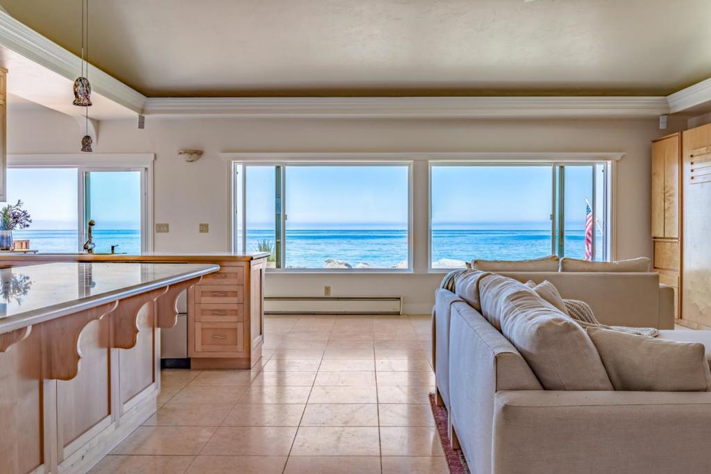 Step into your dream beach side escape at 745 Las Olas, a rare gem tucked away behind a private security gate along one of California's most iconic beaches. Just a few steps from your back door, you'll find yourself standing on the sand of Seacliff State Beach, known for its beauty and world-renowned coastline. Homes in this sought-after community rarely become available, as many have been staying in the same family for generations. This unique property, offering a thoughtful arrangement of living spaces, includes two charming casitas each with its own bedroom and bathroom,perfect for guests, family, or additional rental potential and a separate laundry area. The primary bedroom with an en-suite bathroom is located in the main house, offering a peaceful retreat with ocean views. The main house welcomes you with soaring ceilings and an open-concept kitchen that flows seamlessly into spacious living areas. Expansive windows frame breathtaking views of the Pacific Ocean. Enjoy panoramic vistas, whale sightings, dolphin play, and unforgettable sunrises and sunsets. Located just minutes from local shops, dining, and easy freeway access, this beachfront paradise offers the perfect balance of privacy within an hour from Silicon Valley.