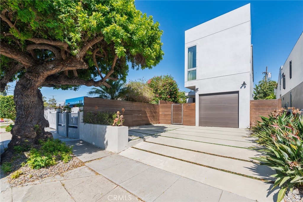 Check out this ultra private 2650 sqft one of a kind custom home, built with the utmost attention to detail. 2 bedrooms and full bathroom on lower level, dual opposite side primary bedrooms with en-suite bathrooms and walk-in closets on upper level make this an excellent family home. Features a private rooftop deck with sunrise/sunsets and city views, brand new eco-friendly lush landscaping to enjoy indoor outdoor living, custom Italian chefs kitchen with commercial grade hood, sub-Z and wolf appliances, hardwareless soft closing cabinets and Caesarstone quartz countertops (in bathrooms as well), heated floors in all bathrooms, large floor to ceiling windows/doors for natural lighting throughout, Italian porcelain tile floors throughout lower level and primary bathroom, French oak wood floors throughout upper level and stairs, SONOS home surround sound, marbled walls, Lutron Radio home automation, Aquasana home filtration. Located in Del Rey, one of LA's hottest locations. Family friendly street, close to great schools including Ocean Charter and many well rated preschools. Near beautiful beaches, top restaurants, shopping, Ballona Creek with easy bike path to beach, 15 min to LAX, Silicon Beach where major tech companies reside such as Yahoo, Facebook, HULU, Google etc...