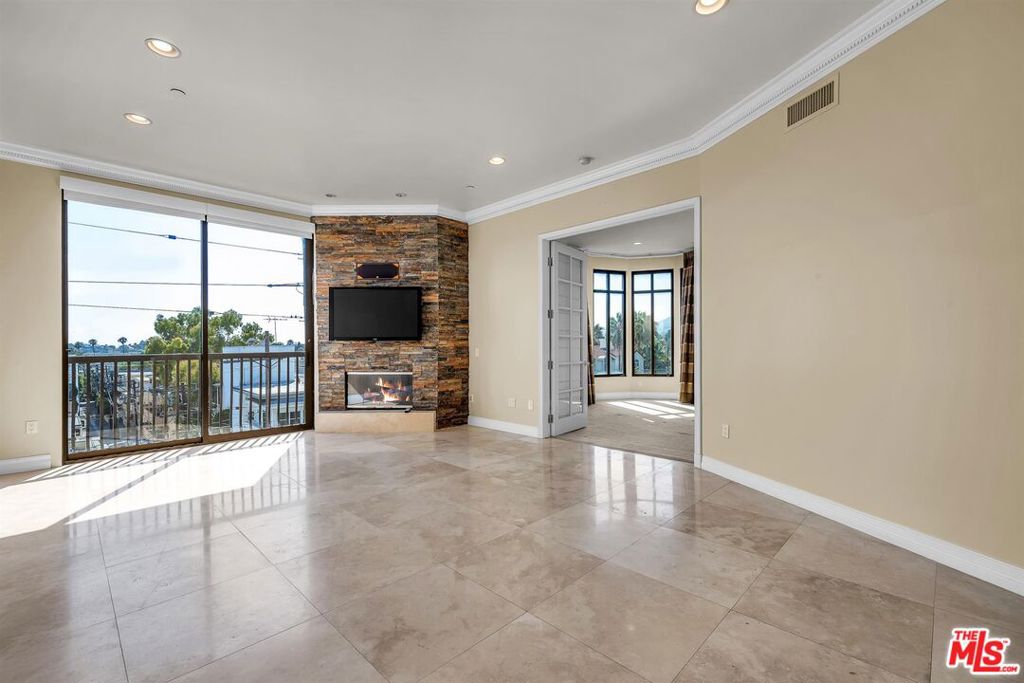Stunning & Bright Front Corner Penthouse Single Level With Spectacular Western Views, Some Ocean Views, And Views Of Getty Museum From Kitchen And Breakfast Area, At "THE WESTGATE", Prime Location In Heart OF BRENTWOOD. 2 + 2.5 Plus Formal Dinning/Den. High Ceilings W/Crown Moldings. Custom Stacked Stone Fireplace. Designer Custom Travertine Flooring In The Living And Wood Floorings in Formal Dinning/Den, Grand Fathered. Wood Flooring In The Large Breakfast Area Designed And Approved By The Developer. Bedrooms Are Carpeted. Tastefully Reimagined, This Spacious Condo Is Not To Be Missed! The Light And Bright Interior Boasts Elevated Finishes. Enjoy Cooking In The Fully Equipped Chef's Kitchen With Top-Of-The-Line Appliances, Granite Countertops And Break Fast Bar. The Generous Primary Bedroom, With Large And Organized Walk-In Closet And Stunning Spa Like En-Suite Bathroom Includes Double Vanity, Expansive Walk-In Shower, Marble Tile Flooring, And Designer Fixtures. Washer Dryer Inside, EQ Insurance. All This With 24-Hour Concierge, Exercise Room And Indoor Spa, Sun Deck, Conference Room, Assigned Storage And Side By Side Parking Plus 30 Additional Guest Parking Spots. Short Distance From Trendy San Vicente Blvd, The Best Restaurants In The Westside, Wholefoods, And Minutes Away From Brentwood's Farmer's Market, And Brentwood Country Club. This Is The One You Have Been Waiting For!! Book Your Appointment Now! Shown By Appointment Only Through Listing Agent.