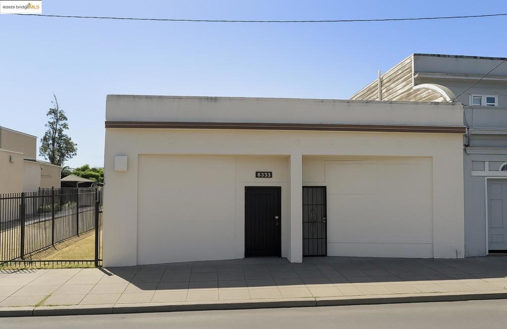 A rare opportunity to own a great building! This building has been used for decades as an automobile repair shop it may hold up to 8+ cars, multiple trucks, various equipment, storage items etc.. This property has the potential to be commercial or industrial. Some or all of the several commercial storage containers on the premises may remain on the property. The property has a roll-up rear door, bathroom, and an expansive rear lot which can hold approximately 15+ vehicles. The driveway leading to the rear of the property is approximately 16 feet wide. Great proximity to Eastmont mall and a planned large apartment complex.