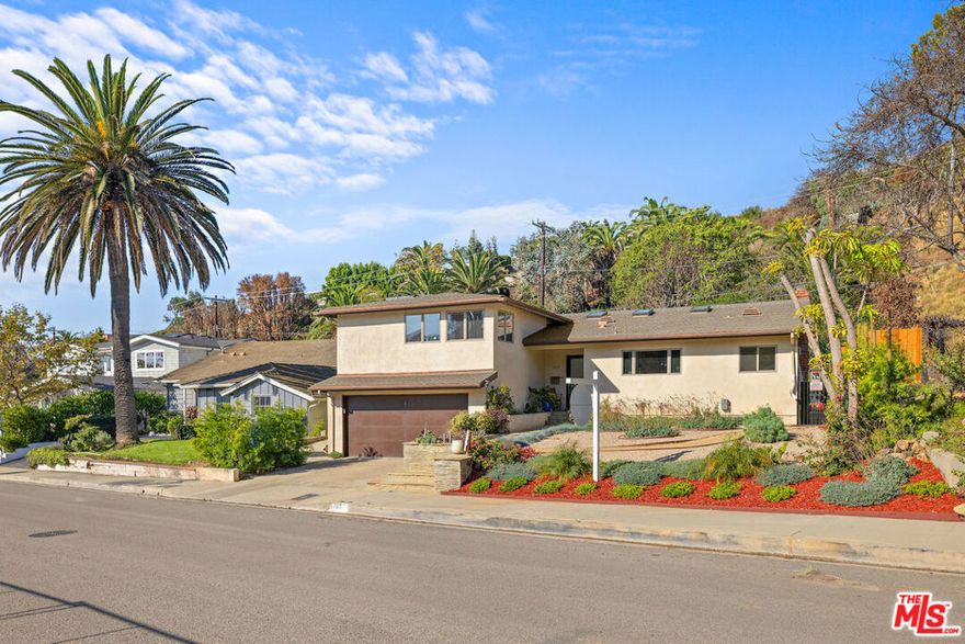 Remodeled, modern, flooded with light, traditional sanctuary in close proximity to Marquez Elementary. The curb appeal is stately. When opening the front door, one is immediately embraced by the open floor plan which encompasses a great room with its cathedral ceilings and hardwood floors setting the tone. The state of the art kitchen, dining area, living and family room all open to oversized, grassy gardens. Beyond the expansive lawn is a gentle hillside with steps to a deck and built in bench, offering wonderful views of the Pacific Ocean nearby. The lower level includes two spacious bedrooms and one bathroom. A luxurious main bedroom suite, with an attached den are half a flight up offering privacy and a glimpse of the ocean.The house includes A/C, an oversized two car attached garage, solar panels and 2 backup batteries.