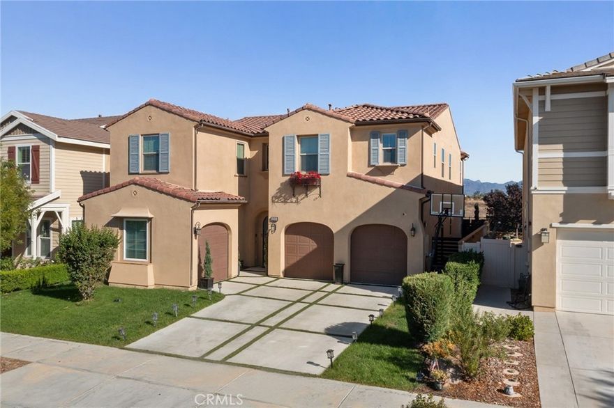 Priced to sell! Welcome to 27636 Camellia Drive, located in the exclusive gated enclave of The Heights at Five Knolls in Santa Clarita. This spacious 3,743 sq. ft. home has been thoughtfully designed to combine modern comfort with timeless appeal. The home offers five generous bedrooms, plus a dedicated office, and four-and-a-half bathrooms, providing plenty of space for family, guests, or multigenerational living. On the main floor, you’ll find a flexible layout that includes a private office and a full bedroom with ensuite bath perfect for working from home, hosting visitors, or accommodating extended stays, multigenerational living etc. The beautifully designed open-concept living areas flow seamlessly, highlighted by large double sliding doors that extend the indoors to the backyard. The outdoor living space is low-maintenance yet ideal for entertaining, with a covered patio, stone fireplace, tiled seating area. Upstairs, the primary suite serves as a private retreat, featuring a spa-like bath with a heated tile walkway, soaking tub, and separate shower. A spacious loft adjoins the suite, offering versatility for a media room, lounge, or play space. Upstairs find an additional 3 bedrooms, 2 fully bathrooms and a well appointed laundry room. Life at The Heights at Five Knolls comes with exclusive community amenities. Residents enjoy beautifully landscaped grounds, secure gated and access to The Club,complete with a resort-style pool, spa, and gathering areas designed for relaxation and entertaining. This property presents a rare opportunity to own within one of Santa Clarita’s most desirable gated communities. With a combination of elegance, functionality, and convenience, 27636 Camellia Drive is more than a home, it’s a lifestyle.