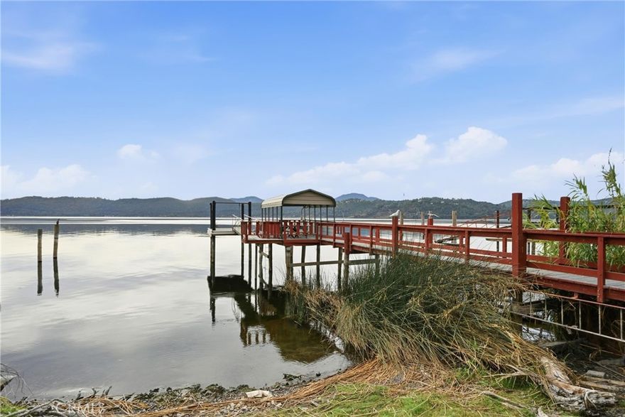 LAKEFRONT fixer home! Own a beautiful piece of lake frontage with existing pier/dock. 1071sqft cabin 2bed/1bath. Property is on public water & sewer. Needs work, but could be brought back to the little fishing getaway it once was! Great lake front yard with private beach. Quiet part of the Lake with deeper water. Only about 10 mins into town. No seller financing at this time.