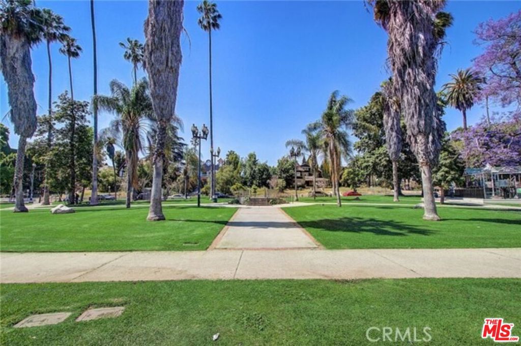 Proud to present this rare Pico-Union property featuring a single-family home, a permitted ADU, and a bonus unit!The main home offers 3 bedrooms and 2 baths with modern upgrades, including luxury vinyl plank flooring, crown molding, a marble-accented fireplace, recessed lighting, and plantation shutters. The kitchen is beautifully finished with quartz countertops, soft-close cabinets, and stainless steel appliances, flowing seamlessly into the dining area. The private primary suite features an en suite bath with a tub and dual showers, while two additional bedrooms share a full bath and laundry.The newly built, permitted ADU is a spacious studio with a full kitchen and stainless steel appliances. A detached bonus room provides excellent space for guests. Additional highlights include 5 parking spaces (2 in garage) and a prime location across from Alvarado Terrace Parkjust minutes from DTLA, LA Live, USC, and Koreatown.