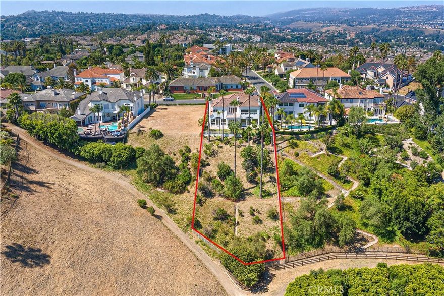 Grand custom estate home situated in one of Nellie Gail Ranch’s finest cul-de-sac locations. An impressive double-door entry leads to a soaring foyer with numerous windows offering expansive views of Saddleback Mountain and city lights. Experience 6,267 square feet of light and bright living, 5 bedrooms plus custom crafted office/study, plus large upstairs media/game room, spacious primary suite offering panoramic views with a private balcony, generous his and her walk-in closets.  An open-concept kitchen seamlessly flows into the family room. Hard to find oversized garage with high ceilings and ample space for vehicles/storage. Lot extends beyond rear fence down to horse trail. Nellie Gail Ranch offers horse stables, pool, tennis/ pickleball courts, club house and parks throughout, NO Mello Roos.