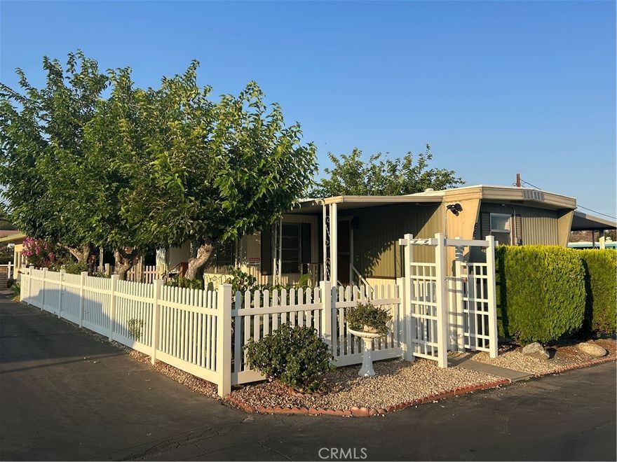 Welcome to age 55+ Linda Vista Mobile Estates! This cozy 2 bedroom home has a premier location with majestic mountain views. The adjacent lot is a beautiful park with a fountain that leads to the pool and clubhouse. For your security there are 3 Ring cameras and inside are 3 Nest smoke/CO2 detectors. The home has updated plumbing, water hearer and electrical. The coach is equipped with 6 extra pylons under the coach and the roof is remastic (white coat) done around a year ago. The home has 2 wall units, a swamp cooler with new motor and filters , plus a large LQ wall AC. The laundry is located outside in a 8x10 Tuff Shed and there is an additional 5x5 aluminum shed for extra storage. The yard is a true cool oasis and garden with beautiful shade trees that protect the home from the sun. The sun set view from the living room and mountain views from the patios offers a peaceful quiet environment. This is a MUST SEE to appreciate!