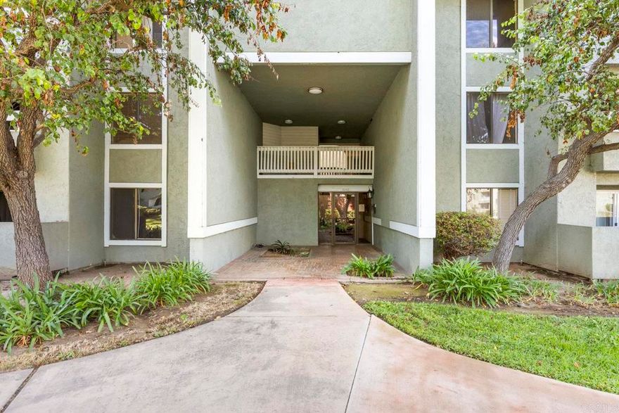 This captivating home boasts 960 square feet of living space offering an ideal blend of comfort, style, and convenience.  As you enter the gated community, you'll appreciate the peace and serenity this complex affords. The home's open floor plan is both welcoming and functional, providing seamless flow. Luxury vinyl plank flooring, stainless steel appliances, and a breakfast bar add a touch of elegance.    The bedroom features mirrored closet doors that not only provide ample storage but also add depth to the room. Step onto the balcony for a breath of fresh air or enjoy cozy evenings by the brick wood-burning fireplace.  Recessed lighting provides warm illumination throughout the property. Two parking spaces and a stackable washer/dryer provide convenience. The community includes access to a community pool and spa—perfect for enjoying Southern California's beautiful weather. Water & Trash included.  Nearby restaurants offers diverse cuisine options. Shopping centers, grocery stores, health facilities, educational institutions, and entertainment venues are all within reach too.