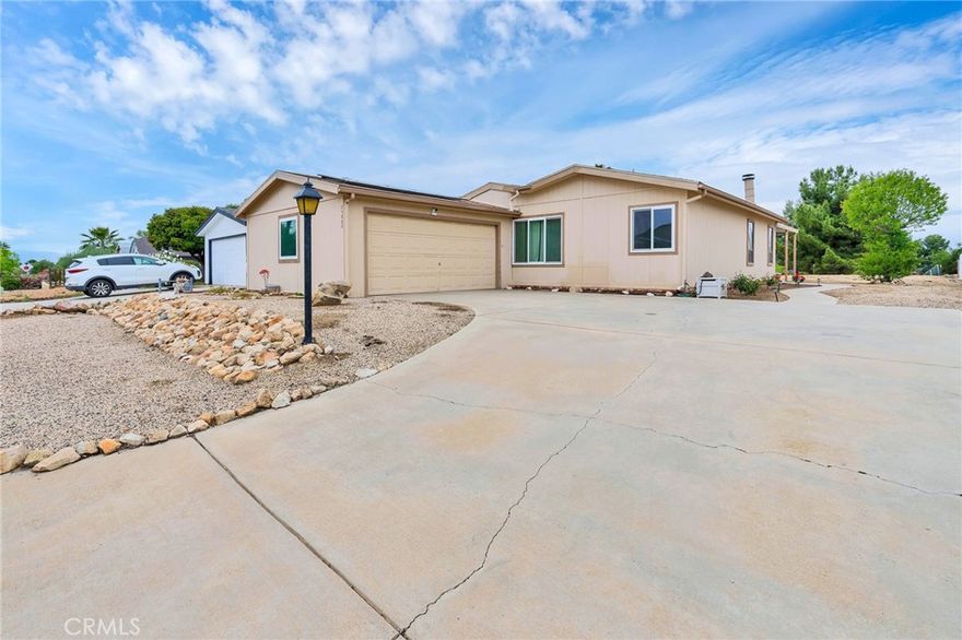 VA ASSUMABLE LOAN with LOW interest rate! Welcome to this stunning 3 bedroom, 2 bathroom home in the highly desired community of the Farm in Wildomar.Thoughtfully upgraded and move-in ready, this home combines comfort, style and the best of Southern California living.Inside you will find new flooring throughout and a spacious, open layout filled with natural light. The bright kitchen features plenty of cabinetry and work space, perfect for every day cooking or entertaining. A cozy fireplace adds warmth and charm to the living room, while large windows frame beautiful mountain views that bring a sense of peace and relaxation. Enjoy energy efficiency and extra comfort with SOLAR panels and a water softener system already in place. Outside, a long concrete driveway leads to a 2-car garage, offering plenty of parking and storage.As part of the incredible community of The Farm, you'll enjoy resort-style amenities including multiple swimming pools, relaxing spa, tennis court, peaceful catch and release fishing pond, a few orange orchards open to the residents, scenic walking and hiking trails and so much more. All of this comes with a super low HOA, making luxury living, quite affordable.With easy access to both the 15 and 215 freeways, commuting is simple while still enjoying a quiet, country-style atmosphere.Don't miss this opportunity to own a beautiful, well-appointed home in one of Wildomar's most  desirable neighborhoods.